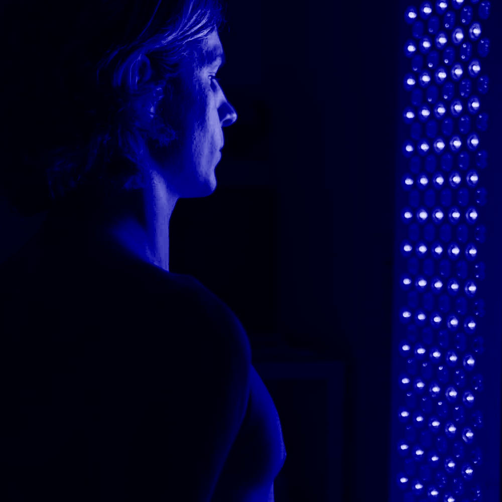 Strong blue light therapy with person