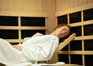 Woman lying down in the sauna room