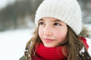 portrait of a small girl in winter nature