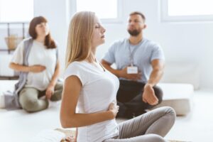 Adults praciticing the breathing